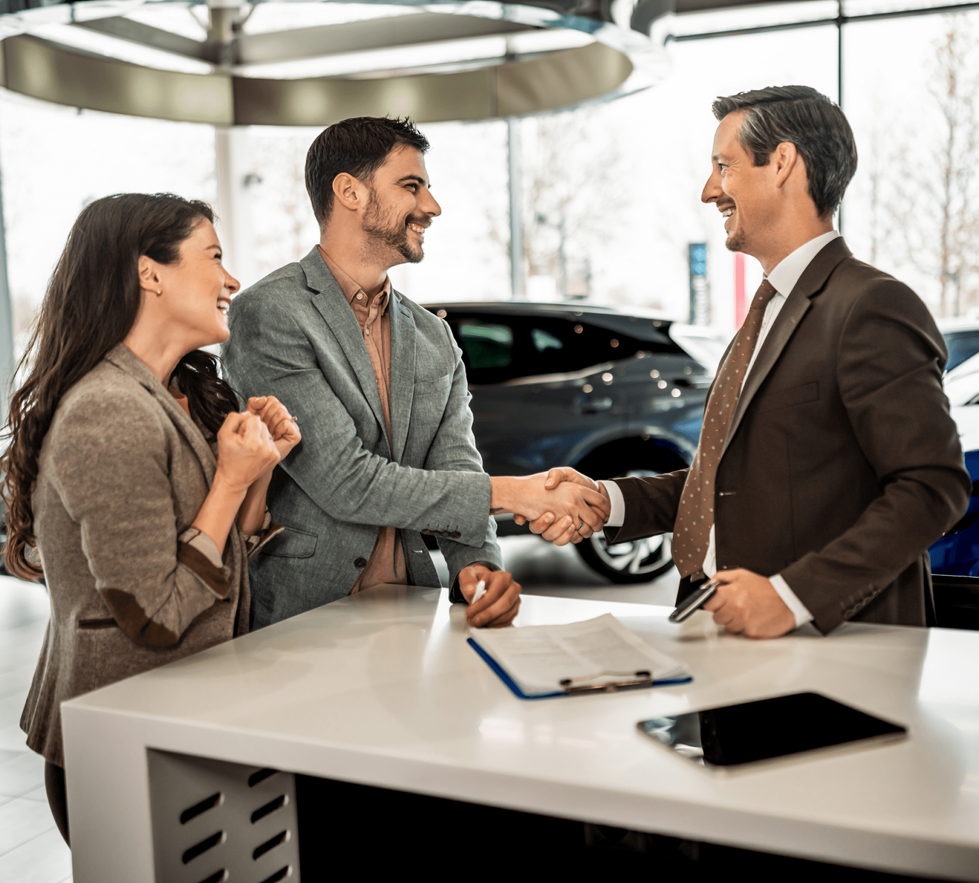 Couple finalizing car purchase deal