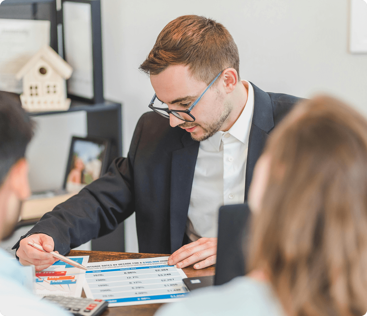 Professional analyzing charts with colleagues